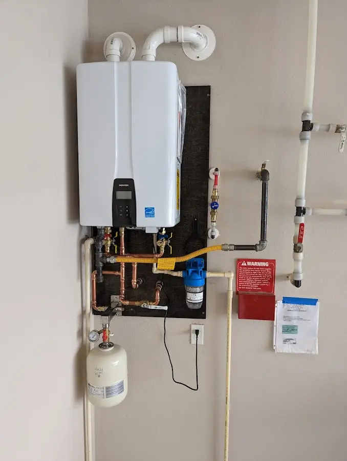 Professional plumber installing copper piping in a Clear Lake home